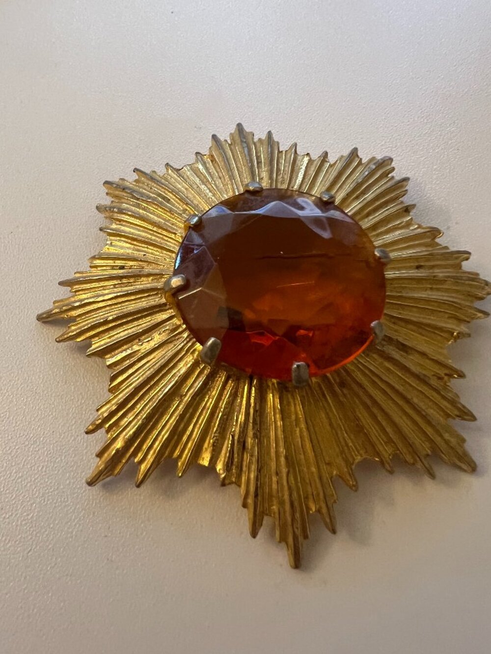 Gold‑Tone Sunburst Brooch
